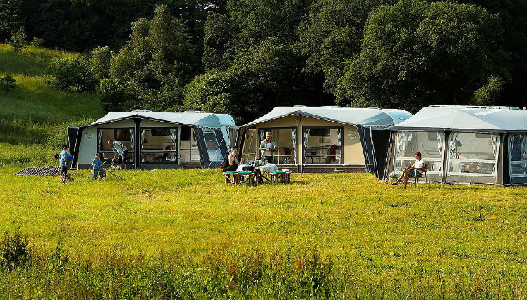 three tents in a field